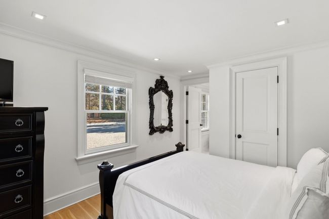 Bedroom featuring light hardwood / wood-style flooring and crown molding | Image 27