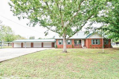 This home sits on a corner lot by a cul de sac. | Image 1