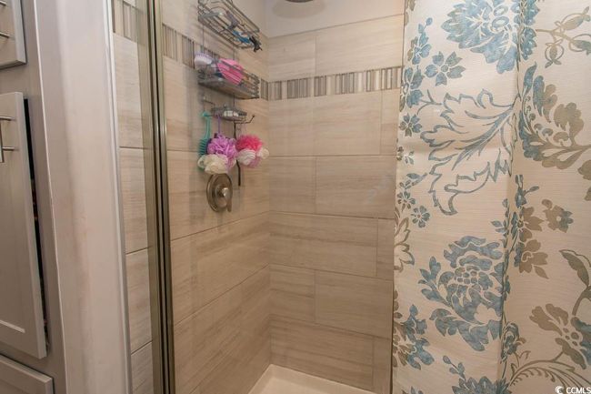 Bathroom with a stall shower | Image 33