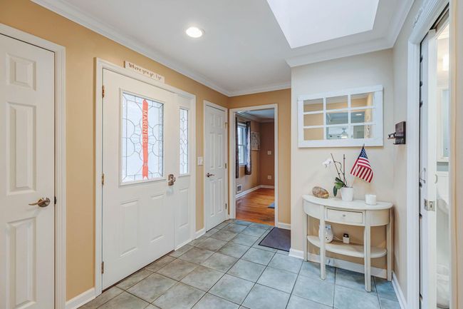 Entryway with baseboards, recessed lighting, ornamental molding, and light tile patterned flooring | Image 15