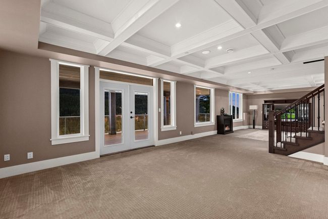 Interior space featuring beamed ceiling, carpet floors, and french doors | Image 31