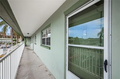 Walkway and unit front door | Image 3