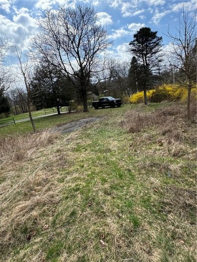 Small parking pad near driveway. Dellenbaugh Hts. is on the right of the photo. | Image 2