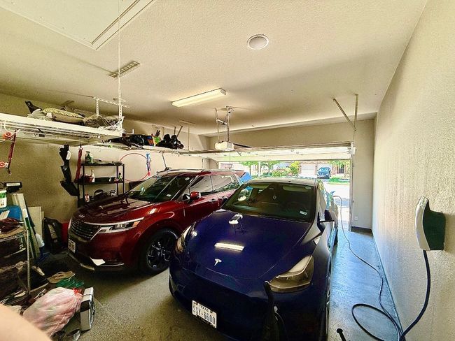 Garage featuring a garage door opener | Image 37