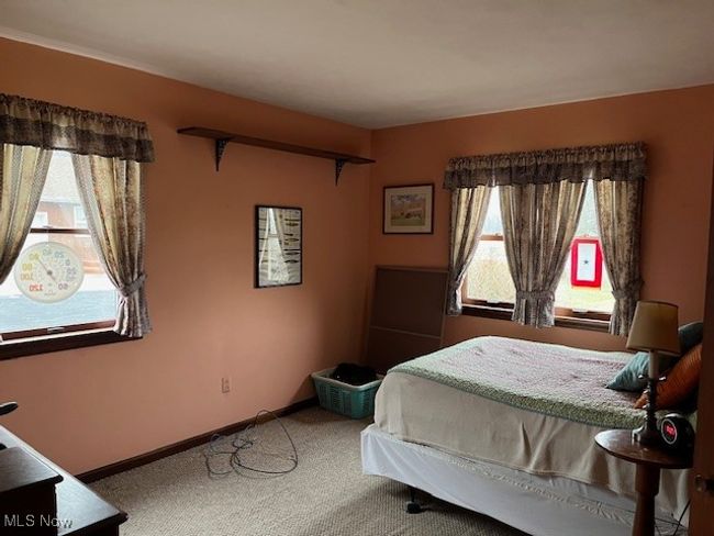 Bedroom featuring few shelves | Image 23