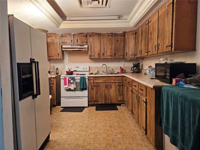 kitchen has plenty of cabinetry to fit all of your kitchen goods. | Image 2