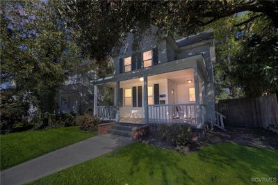 View of front of home with a front yard and covered porch | Image 1