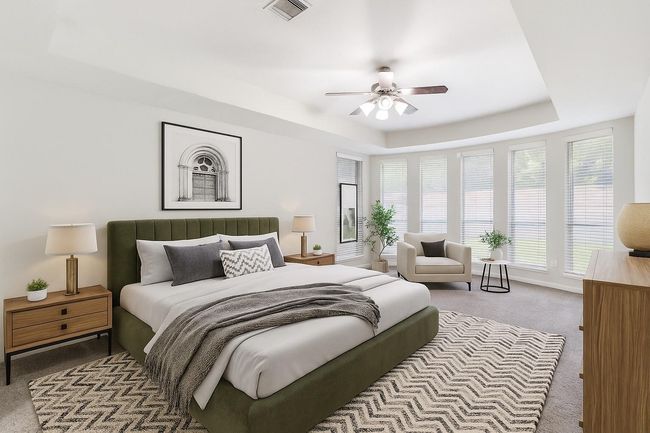 Incredibly spacious first floor primary bedroom with tons of windows! Virtually staged to show space and design versatility. | Image 14