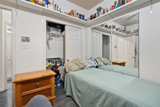 Two additional bedrooms with large closets share a perfectly placed second full bath in the hallway. | Image 29