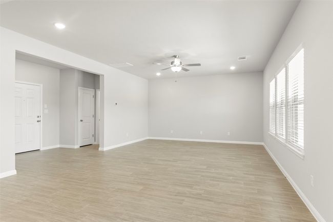 Unfurnished room featuring ceiling fan, recessed lighting, light wood finished floors, and baseboards | Image 9