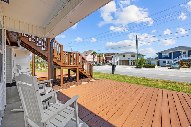 Deck with stairway and a residential view | Image 15