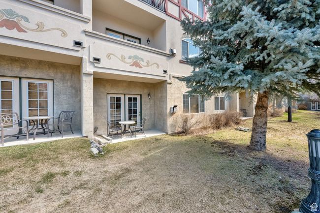 Back of property featuring stucco siding and a patio | Image 23