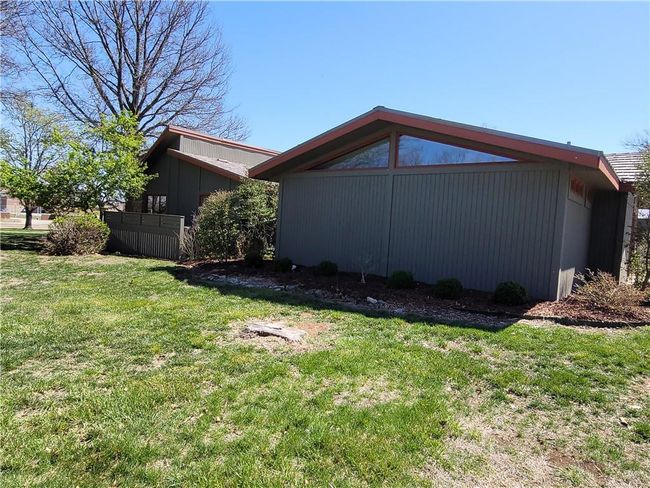 View of property exterior with a lawn | Image 67