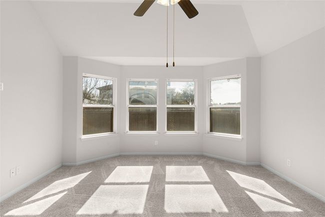 Unfurnished sunroom featuring lofted ceiling and a ceiling fan | Image 31