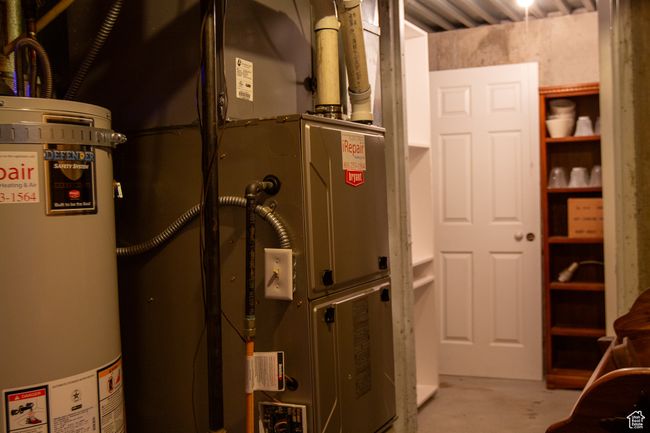 Utility room with water heater, furnace, storage | Image 26