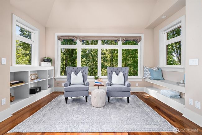 Sunlit Sitting Room Surrounded by Nature - Builtin Bookcases & Hardwood Floors | Image 11