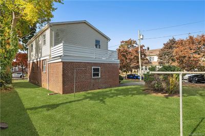 View of property exterior with a lawn | Image 3