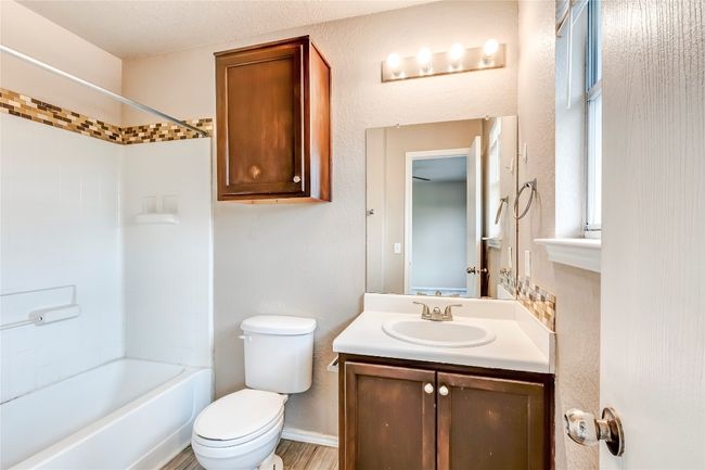 Full bathroom featuring vanity and tub / shower combination | Image 16