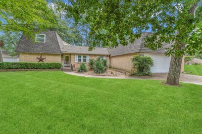 This charming two-story, single-family home has a welcoming entrance. | Image 1