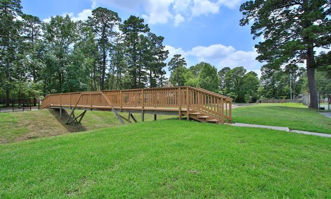 This bridge offers a convenient walkway connecting the pool and tennis courts to the park and playground | Image 47