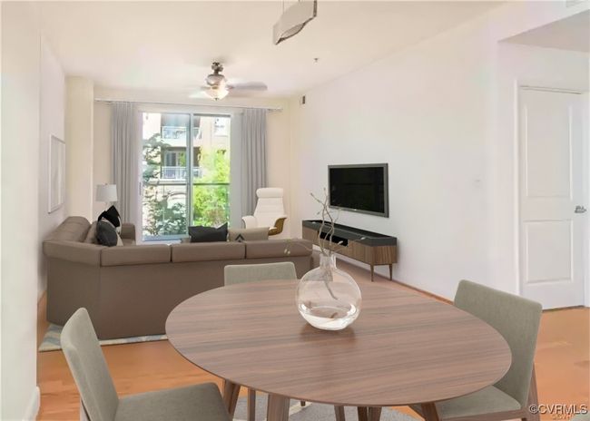 Dining area featuring light wood-type flooring and a ceiling fan | Image 7