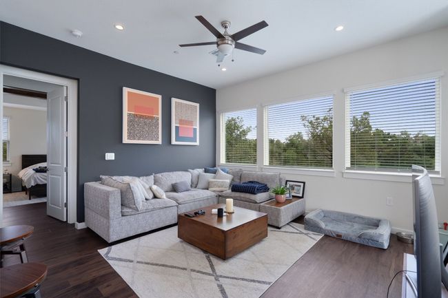 Living area featuring plenty of natural light, ceiling fan, wood finished floors, and recessed lighting | Image 18