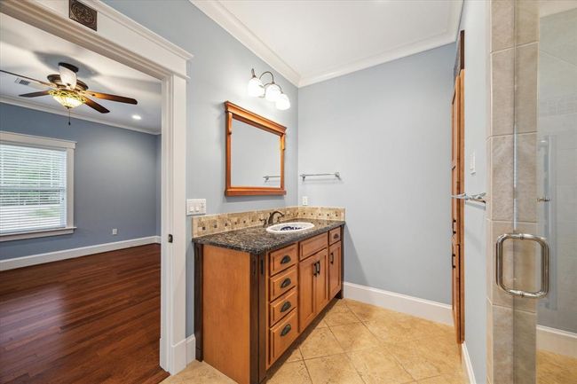 THE CUSTOM CABINET SHOWCASES TWO DISTINCT WOOD FINISHES. | Image 29