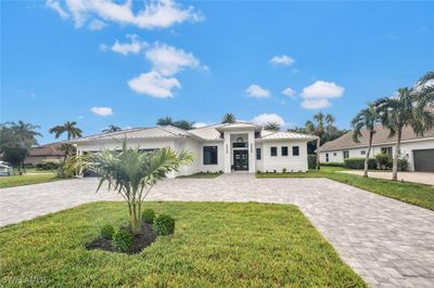 View of front of property featuring a brick paver circular driveway | Image 2