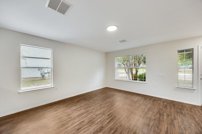 Unfurnished room with dark wood-style flooring and baseboards | Image 9