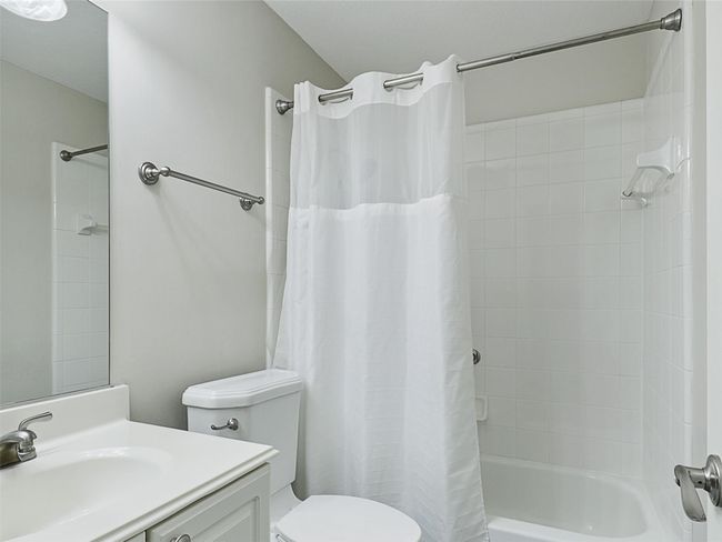 Bathroom featuring vanity and shower / tub combo | Image 36