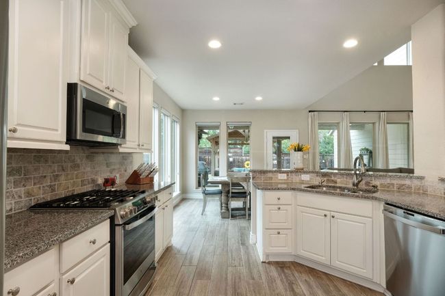 Also features a breakfast bar, perfect for a casual meal. | Image 8