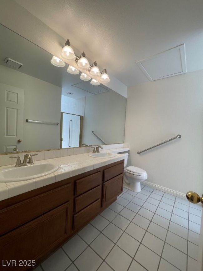 Full bath featuring double vanity and tile patterned floors | Image 16