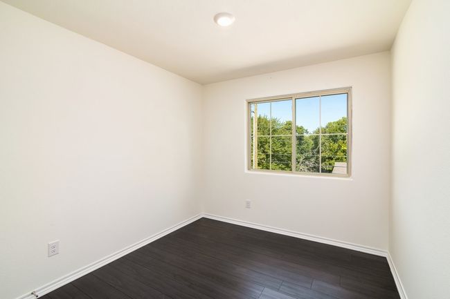 Spare room featuring dark wood-type flooring | Image 11