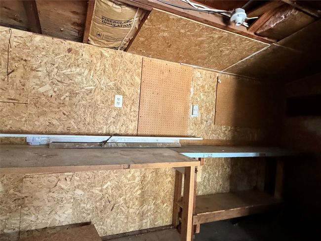 Storage area featuring ceiling fan | Image 47