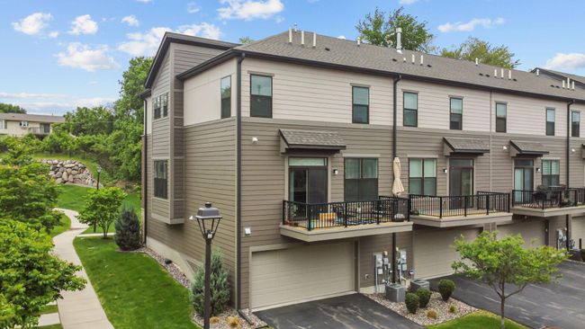 Wide 2-car garage with deck overlooking the space. | Image 38