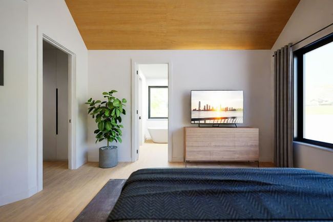 Primary Suite with vaulted wood ceiling, large picture window, and a spa-like ensuite bathroom. | Image 14