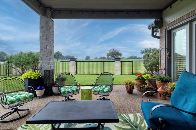 Covered patio with views of the golf course. | Image 31