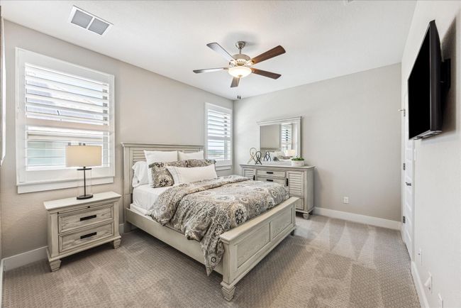 Each bedroom upstairs features a ceiling fan, walk in closet and shutters that allow you to easily control the amount of sunlight that comes into the room. | Image 30