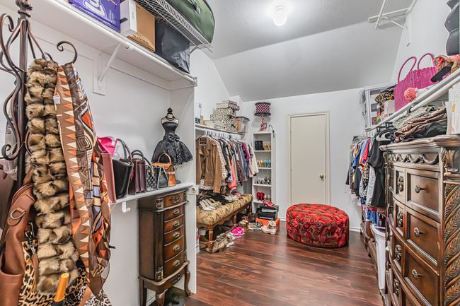 Walk in closet with wood finished floors and vaulted ceiling | Image 22