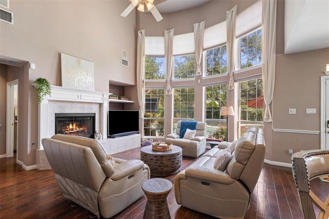 High ceilings and bay windows in the family room. | Image 11