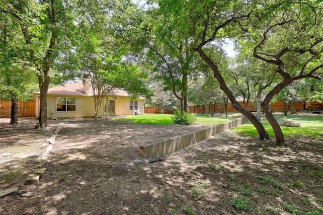 View of fenced backyard | Image 29