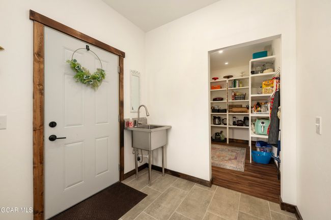 Mudroom featuring Walk In Pantry. | Image 25