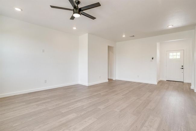 Spare room featuring visible vents, a ceiling fan, and recessed lighting | Image 14