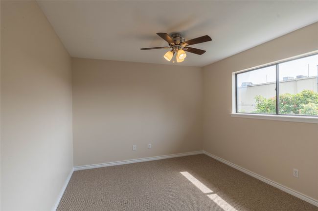 Spare room with carpet, ceiling fan, and baseboards | Image 28