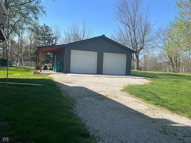 Garage with 8 ft porch on the east side | Image 6