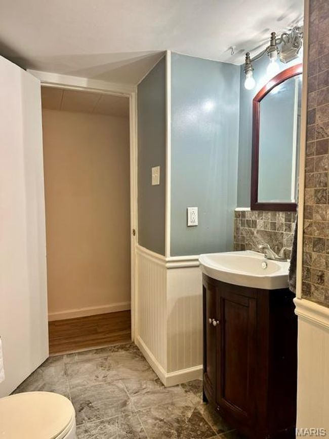 Bathroom featuring vanity and toilet | Image 24