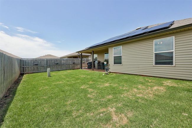 View of fenced backyard | Image 41