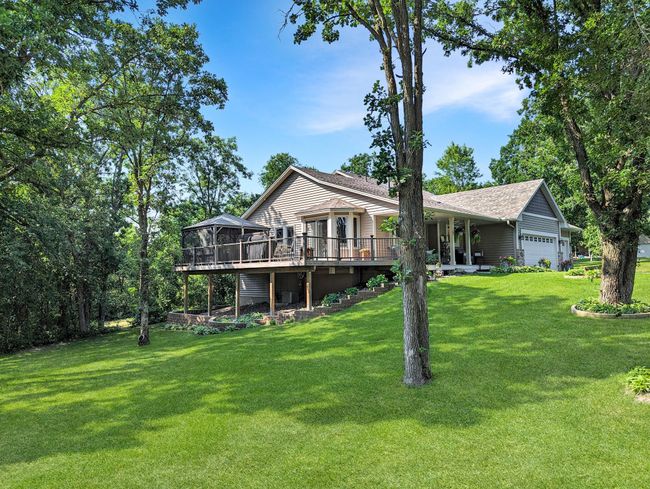 Gorgeous maintenance free deck overlooks manicured lawn. | Image 6