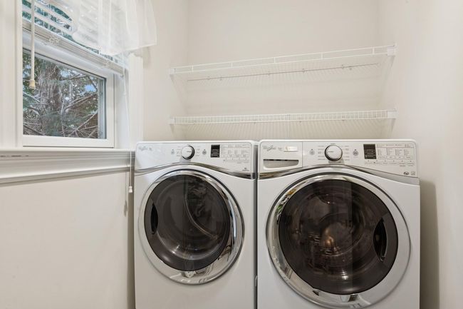 Laundry room featuring washer and clothes dryer | Image 9