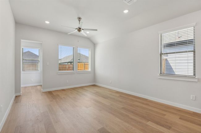 Spare room with ceiling fan, light wood-type flooring, baseboards, and recessed lighting | Image 7